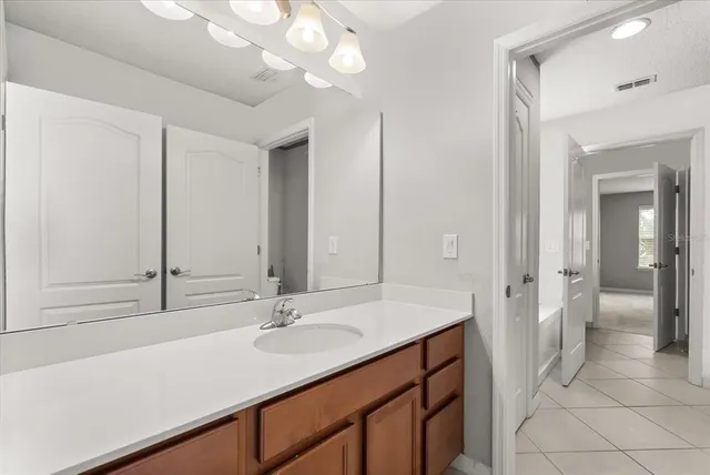 a bathroom with a sink double vanity and a mirror