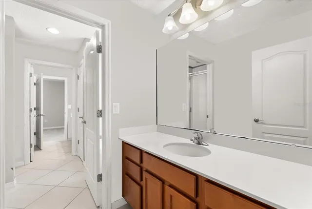 a bathroom with a sink double vanity and a mirror