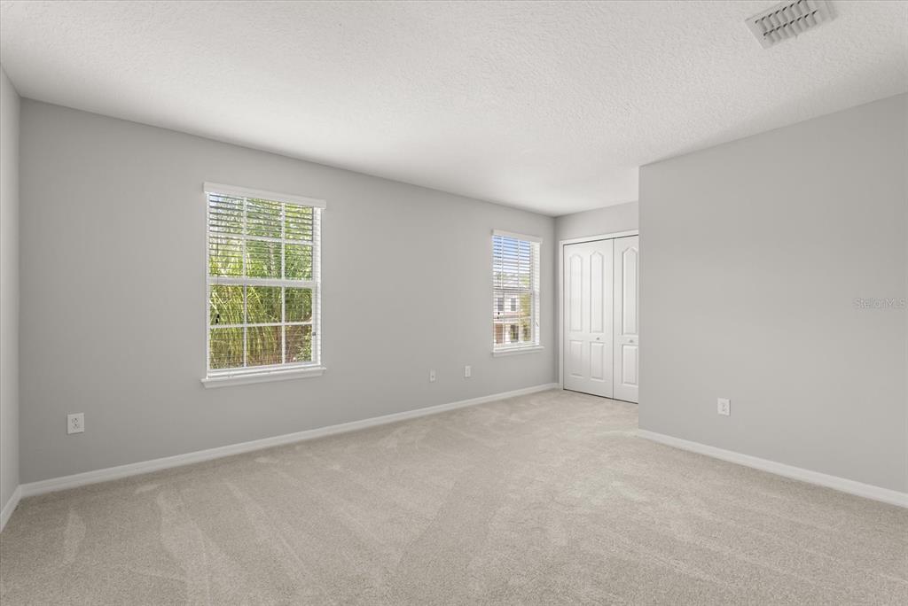 4345 Saltmarsh Sparrow Drive Windermere, FL 34786 - Photo 37 of 46 an empty room with windows