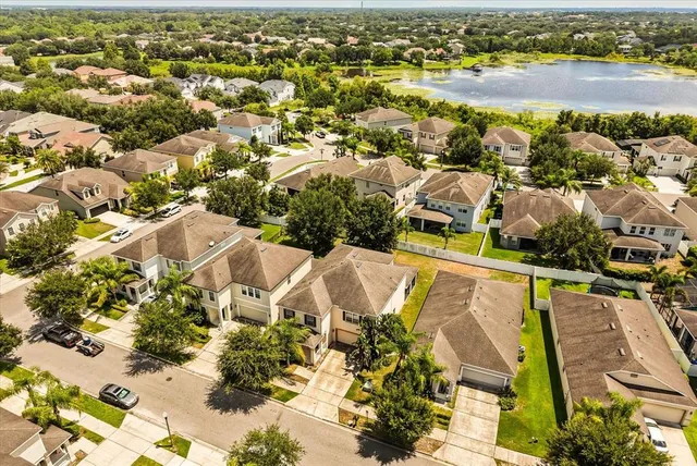 an aerial view of residential houses with outdoor space