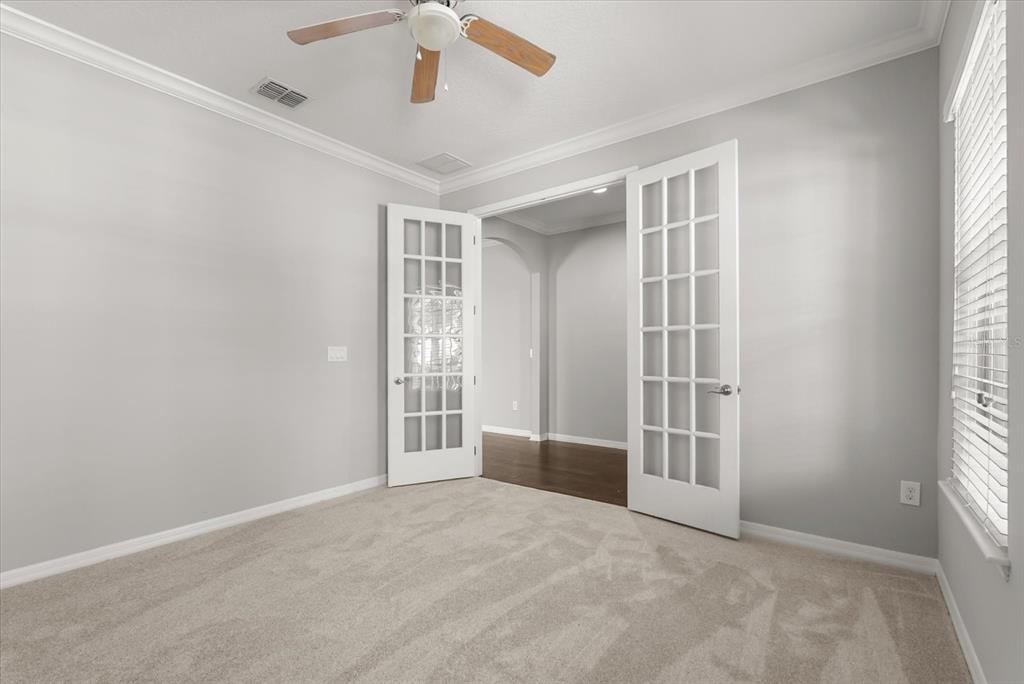 4345 Saltmarsh Sparrow Drive Windermere, FL 34786 - Photo 5 of 46 an empty room with windows and entryway