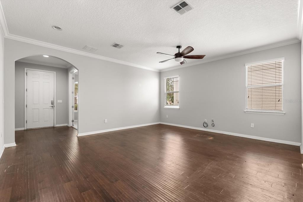 4345 Saltmarsh Sparrow Drive Windermere, FL 34786 - Photo 9 of 46 an empty room with wooden floor and windows