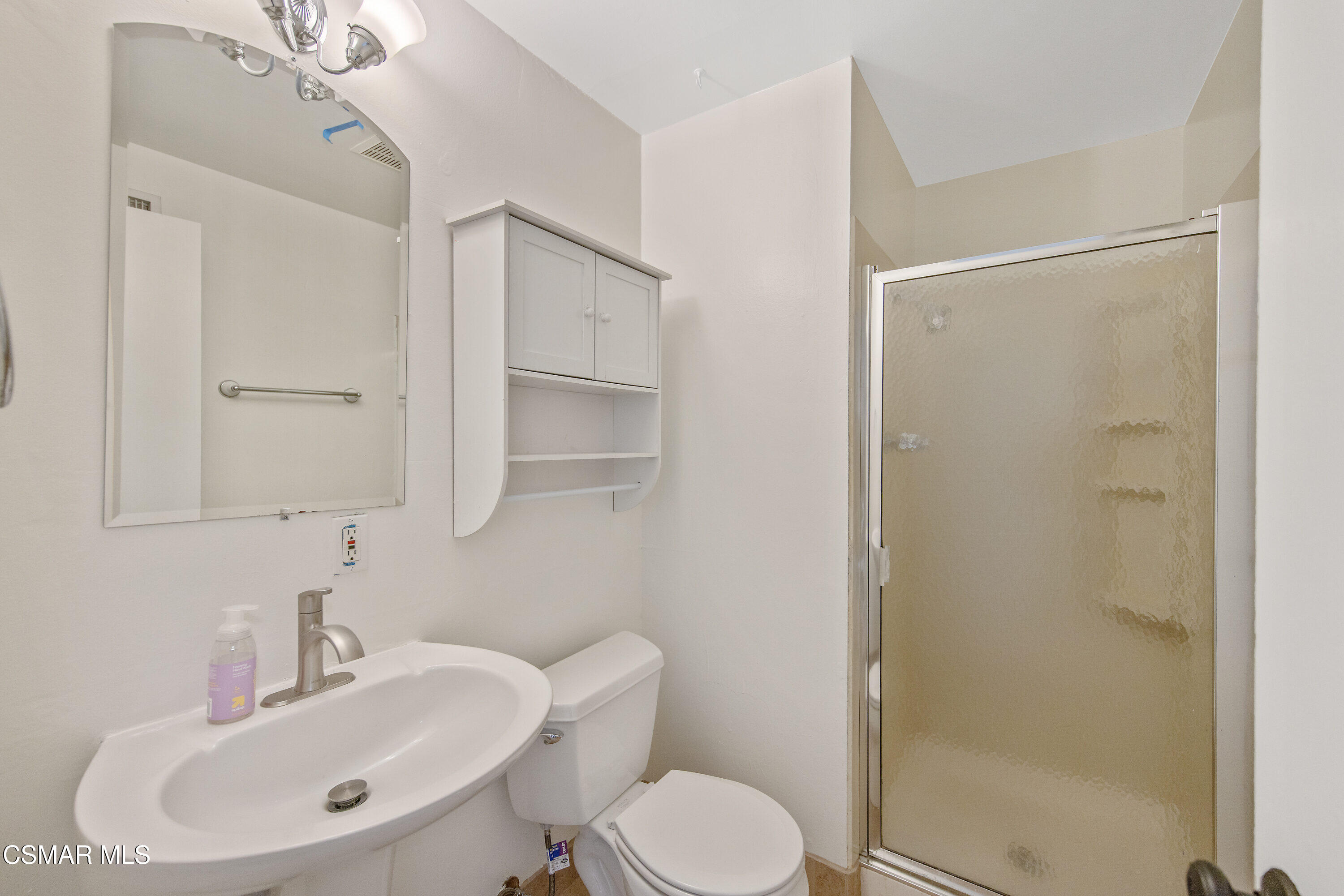 2087 Rhoda Street Simi Valley, CA 93065 - Photo 19 of 22 a bathroom with a sink toilet and shower
