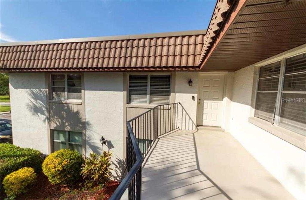 170 Windtree Lane Winter Garden, FL 34787 - Photo 3 of 14 a view of entryway with wooden floor