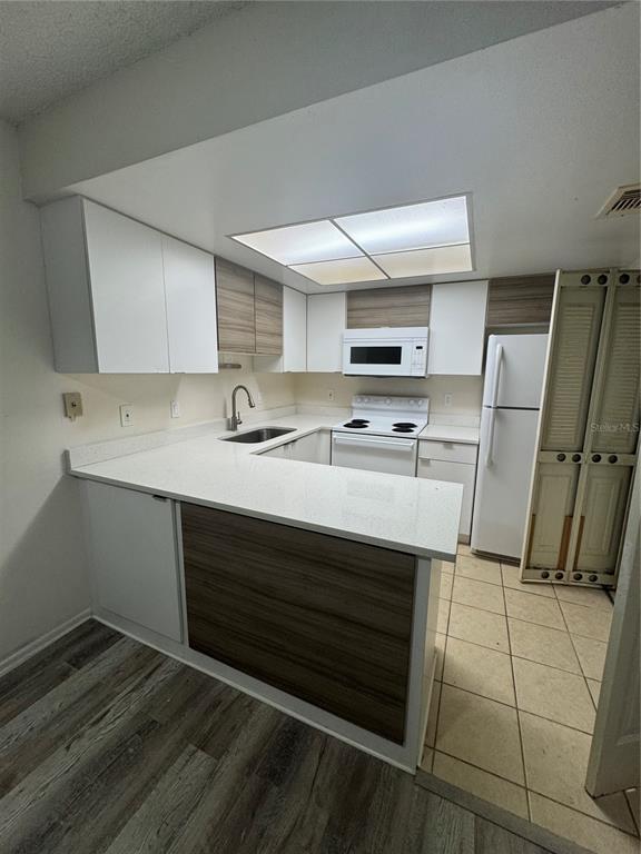 170 Windtree Lane Winter Garden, FL 34787 - Photo 6 of 14 a kitchen with stainless steel appliances a stove a sink and a refrigerator