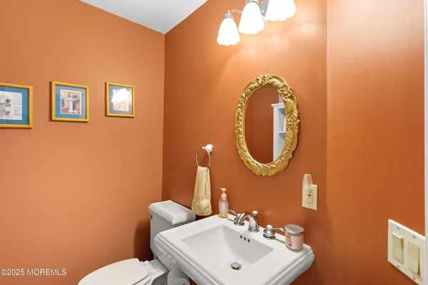 a bathroom with a toilet and a sink