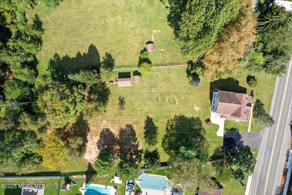 an aerial view of residential houses with outdoor space
