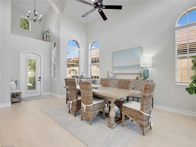 a view of a livingroom with furniture and a window