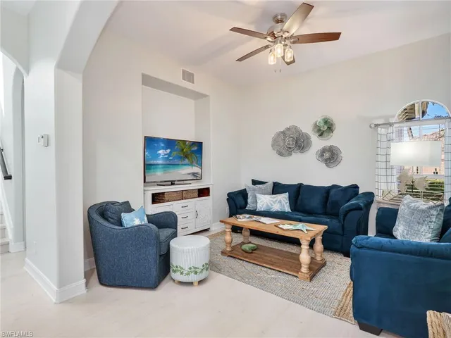a living room with furniture and a table