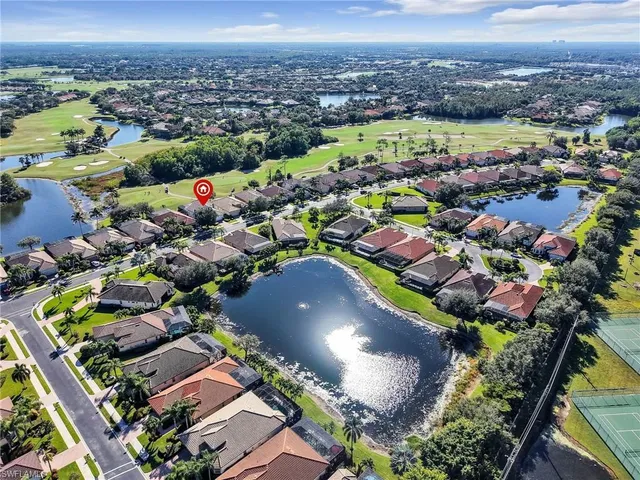 an aerial view of residential building and lake