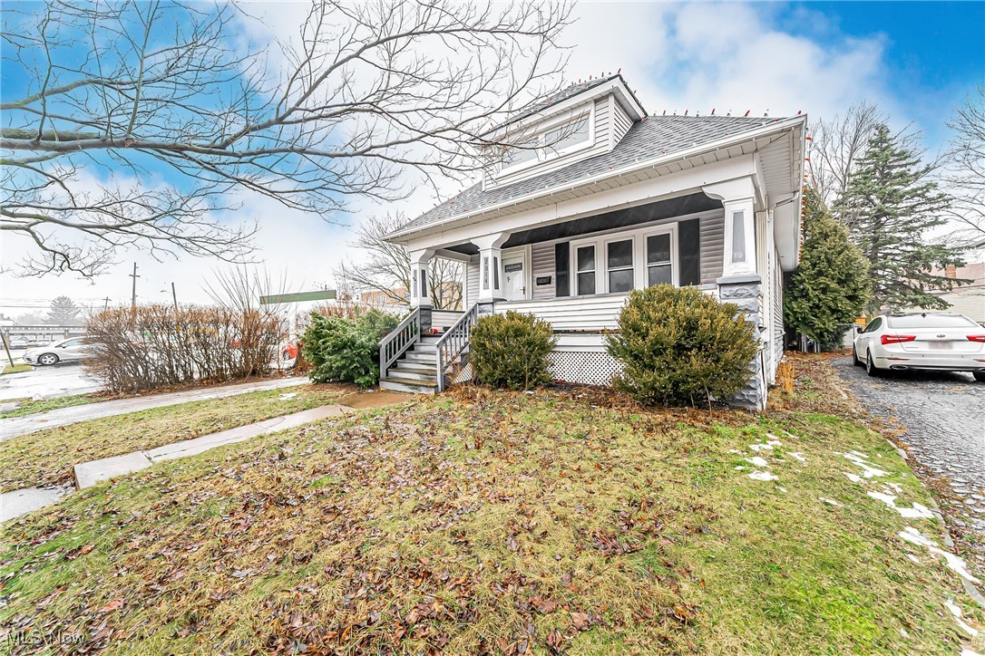 2014 Cook Avenue Cleveland, OH 44109 - Photo 3 of 37 Bungalow featuring a porch and a front yard