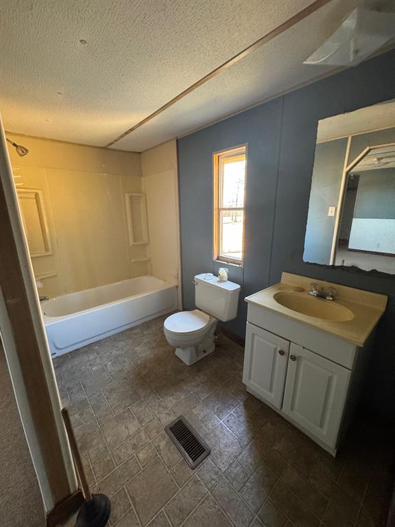 593 Ayers Jamestown, LA 71045 - Photo 8 of 22 a bathroom with a sink a toilet and a mirror