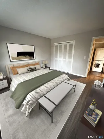 a bedroom with a bed and a television