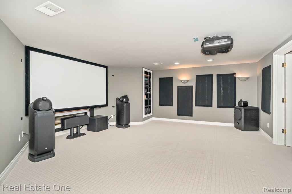 5575 Murfield Drive Rochester, MI 48306 - Photo 38 of 53 Basement theatre room (only projector and screen stay)