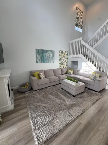 a living room with furniture and a table