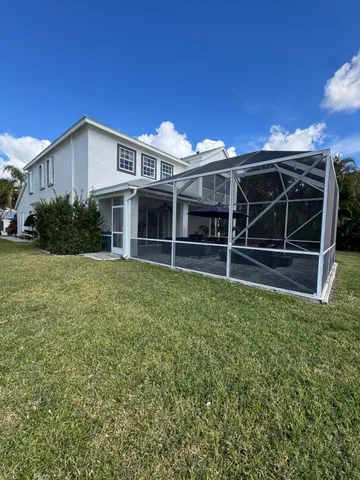a view of dinning table and chairs in patio