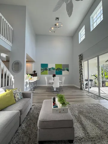 a living room with furniture and a table