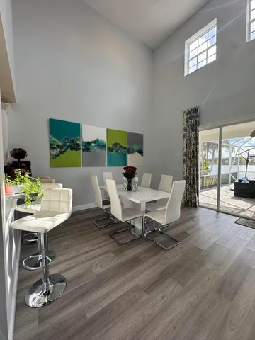 a workspace with furniture window and wooden floor