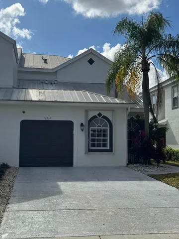 a front view of a house with a garage