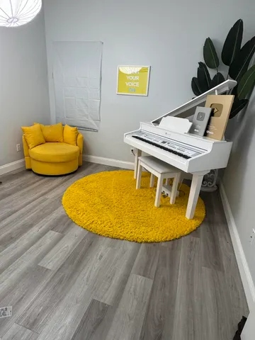 a blue swimming pool with a chairs