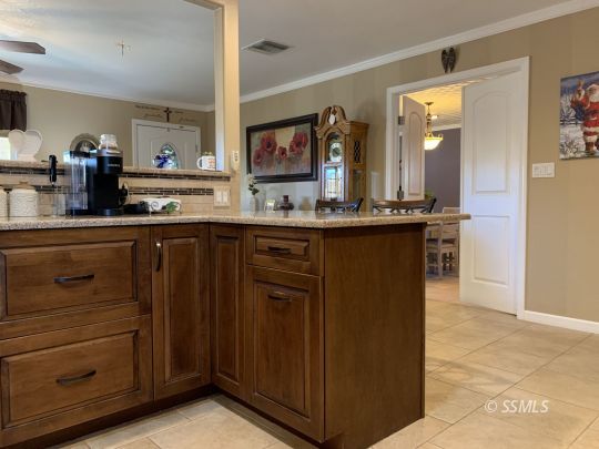 1320 Mayo Street Ridgecrest, CA 93555 - Photo 14 of 45 a kitchen with a sink and cabinets