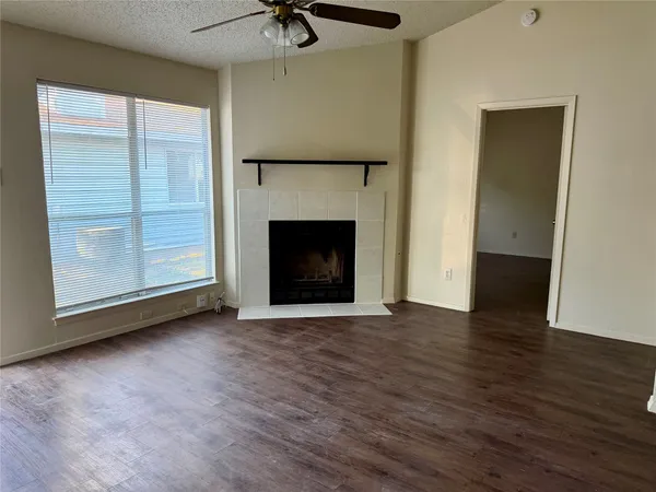 a kitchen that has a sink and wooden floor