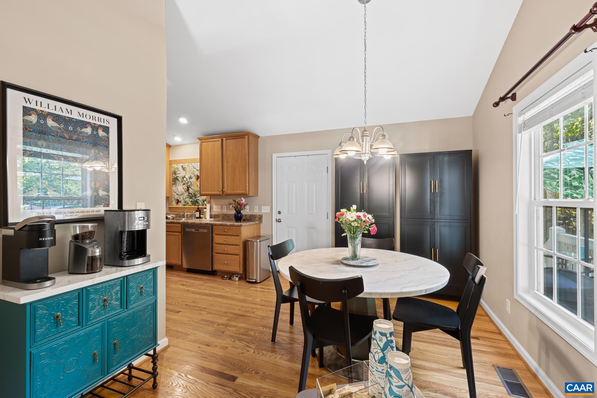 464 Hummingbird Road Scottsville, VA 24590 - Photo 11 of 31 a kitchen with a dining table chairs and granite counter tops