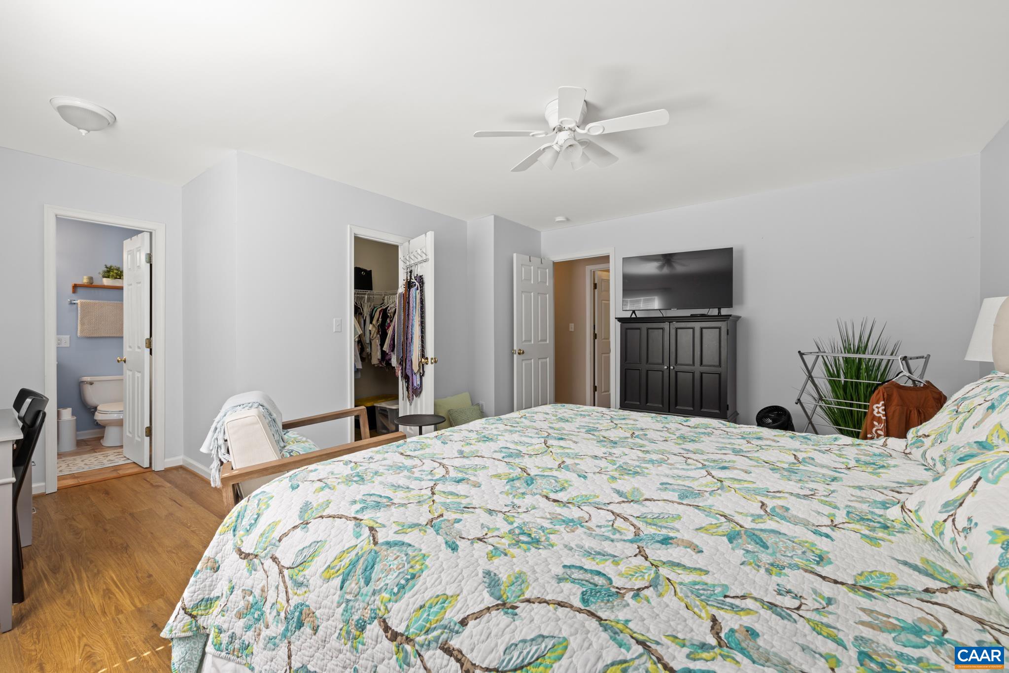 464 Hummingbird Road Scottsville, VA 24590 - Photo 18 of 31 a bedroom with a bed and wooden floor