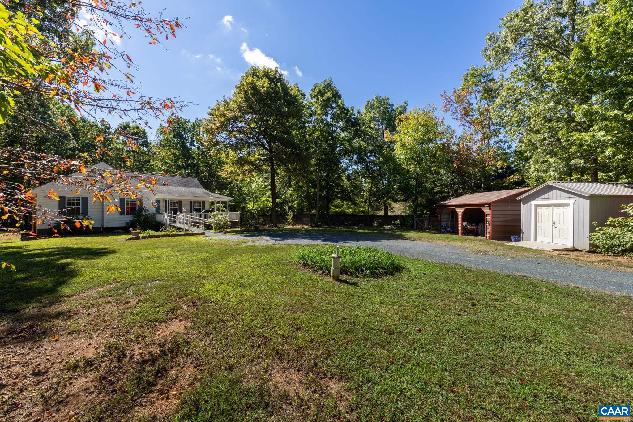 464 Hummingbird Road Scottsville, VA 24590 - Photo 2 of 31 a front view of a house with garden