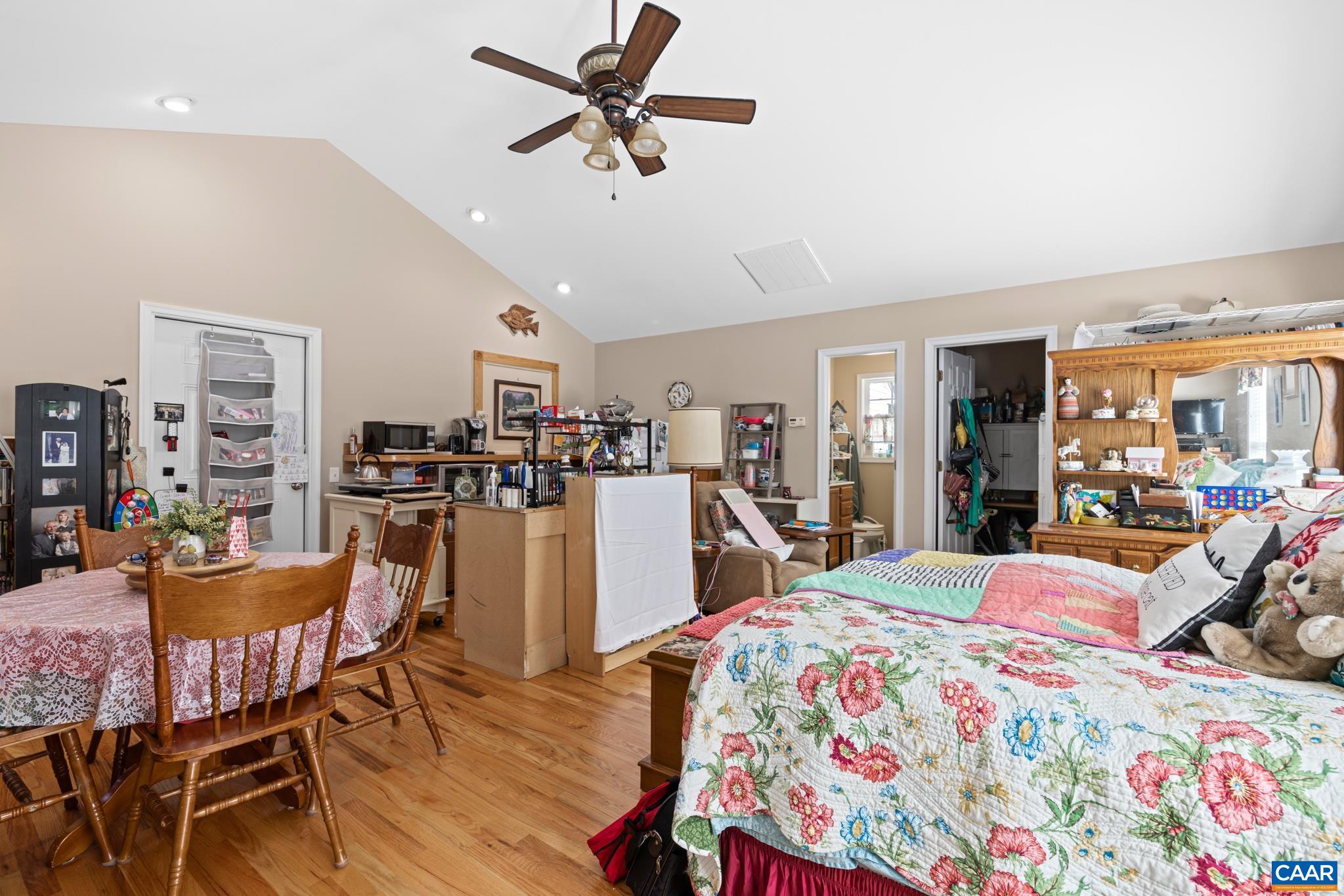 464 Hummingbird Road Scottsville, VA 24590 - Photo 25 of 31 a bed room with a bed and a chandelier