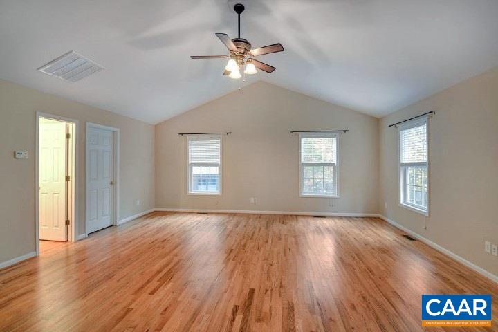 464 Hummingbird Road Scottsville, VA 24590 - Photo 27 of 31 a view of an empty room with wooden floor and a window