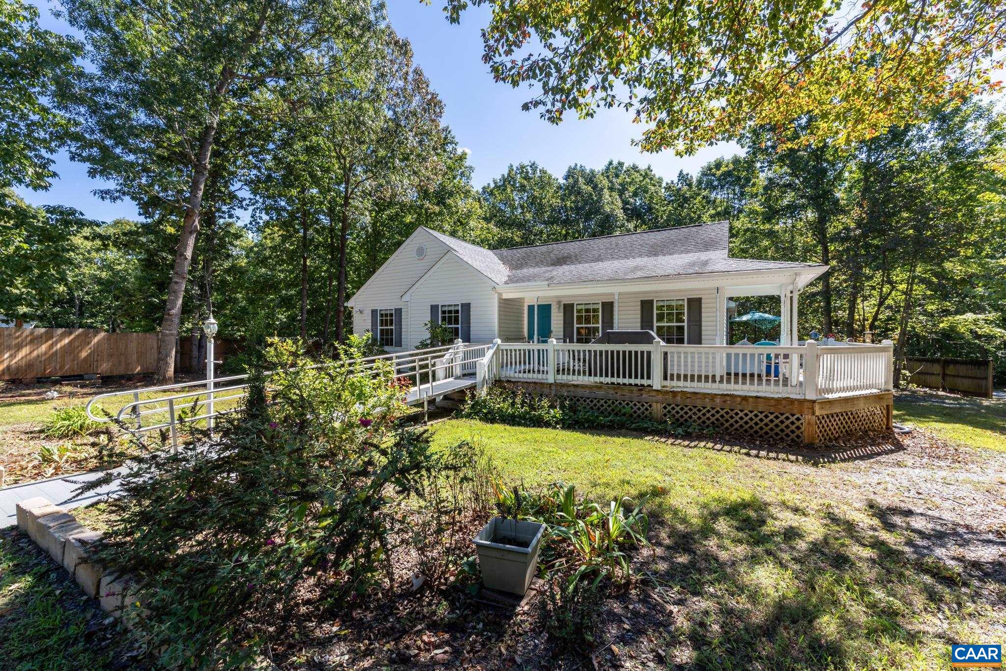 464 Hummingbird Road Scottsville, VA 24590 - Photo 6 of 31 a view of a house with swimming pool and garden