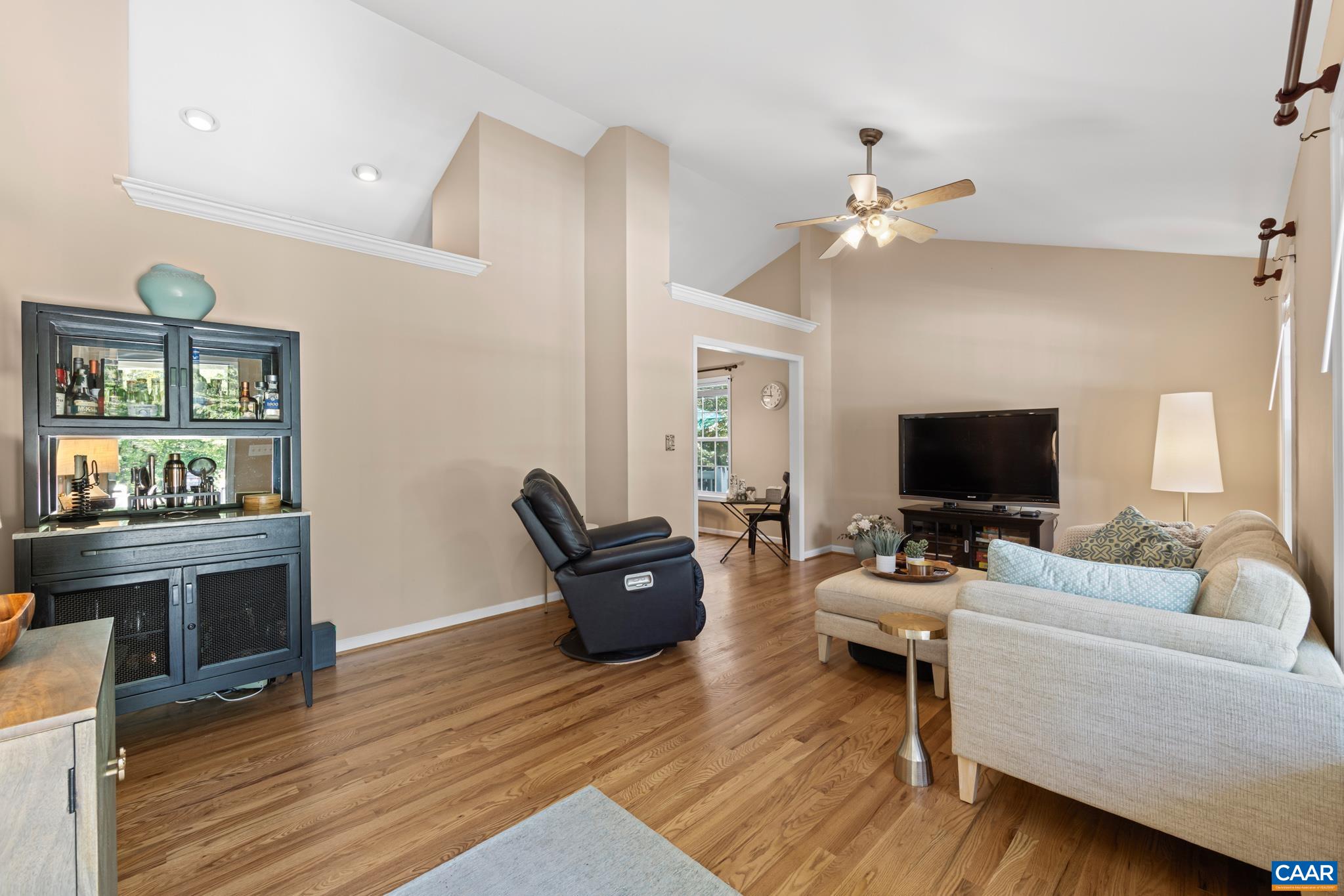 464 Hummingbird Road Scottsville, VA 24590 - Photo 9 of 31 a living room with furniture a fireplace and a flat screen tv