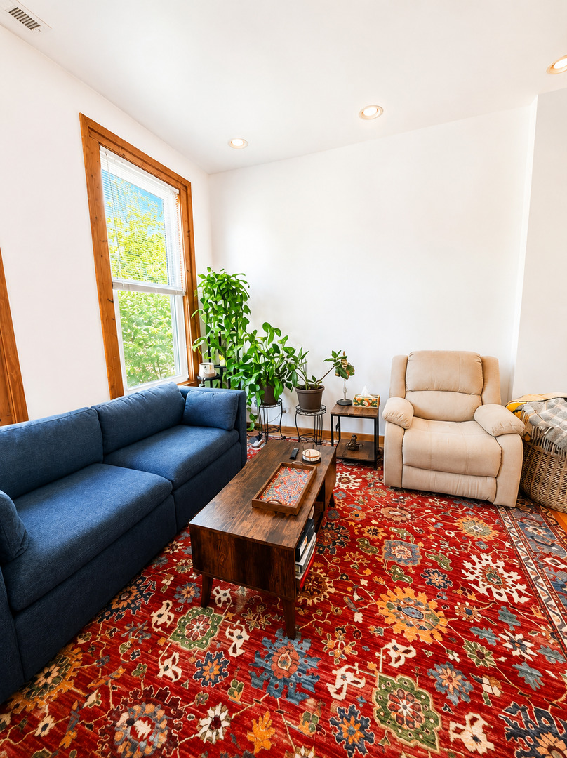921 South Bishop Street, Unit 2 Chicago, IL 60607 - Photo 8 of 14 a living room with furniture and a large window