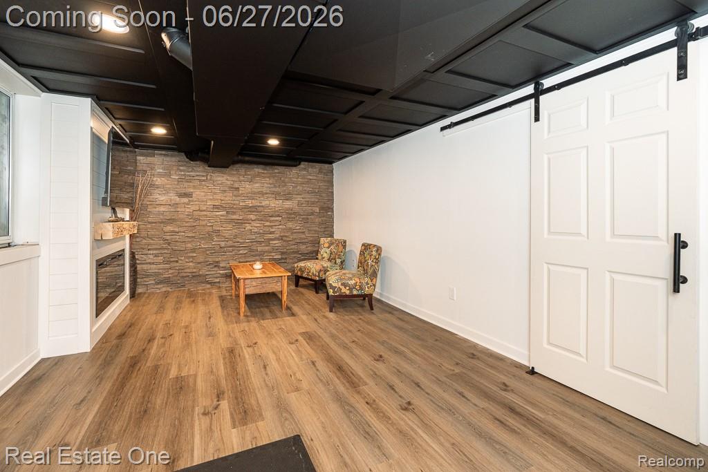 1222 Kings Cove Court, Unit 244 Rochester, MI 48306 - Photo 28 of 44 Flex room can be used as Family roon, home office, exercise room, media room or guest retreat. Barn door leads to laundry area.