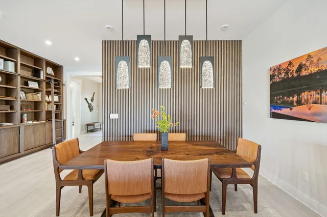 a large kitchen with a table and chairs