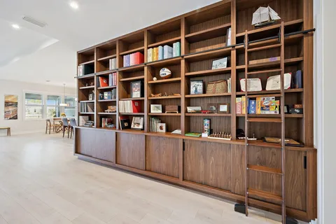 a large kitchen with a table and chairs