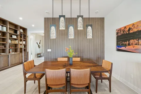 a kitchen with stainless steel appliances granite countertop a sink a stove and cabinets