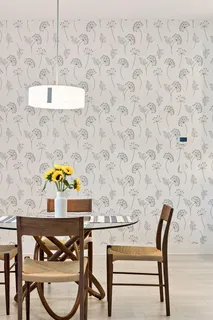 a view of a livingroom with workspace and a window