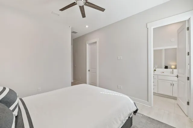 a living room with furniture a fireplace and windows