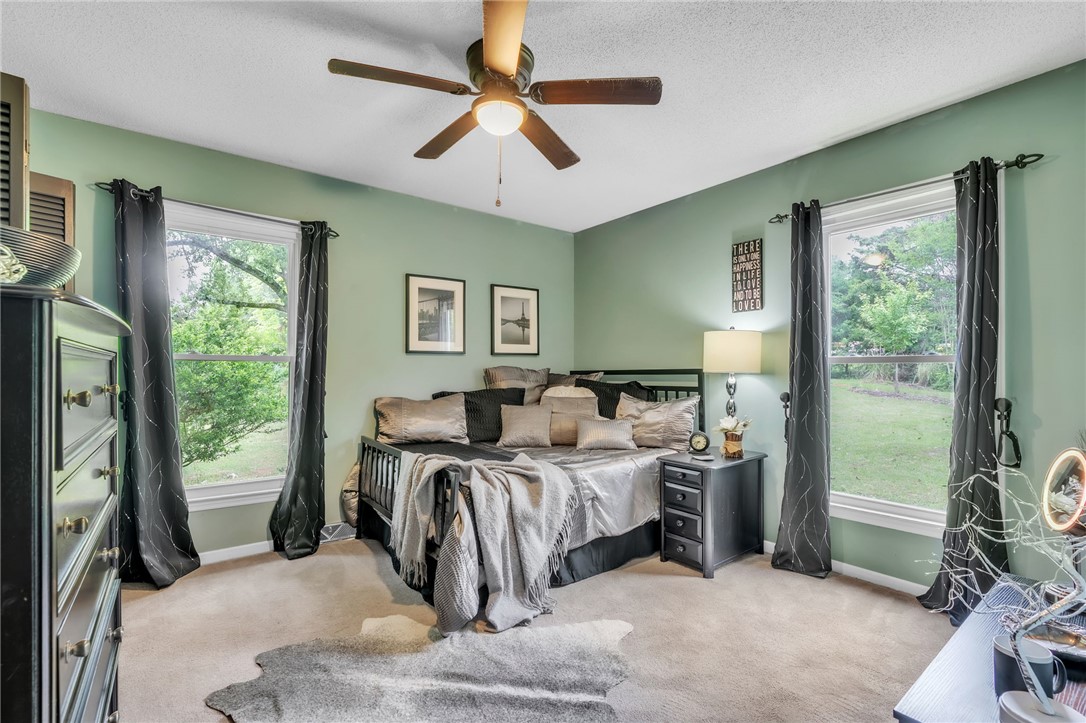 722 Lay Bridge Road Central, SC 29630 - Photo 20 of 32 This cozy bedroom provides a tranquil retreat with ample natural light.
