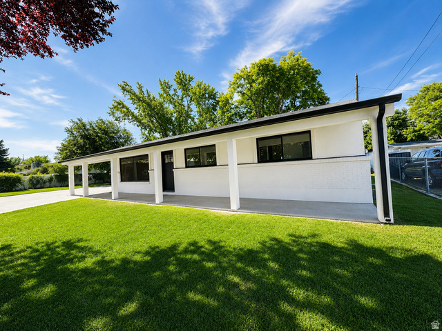 1898 West 600 South Provo, UT 84601 - Photo 2 of 32 Contemporary single-story residence with a white brick exterior and contrasting black trim