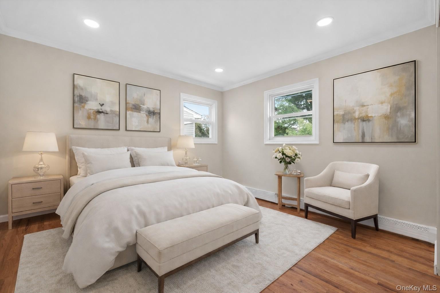 15 Lindsay Street Huntington, NY 11743 - Photo 12 of 23 a spacious bedroom with a bed and a couch