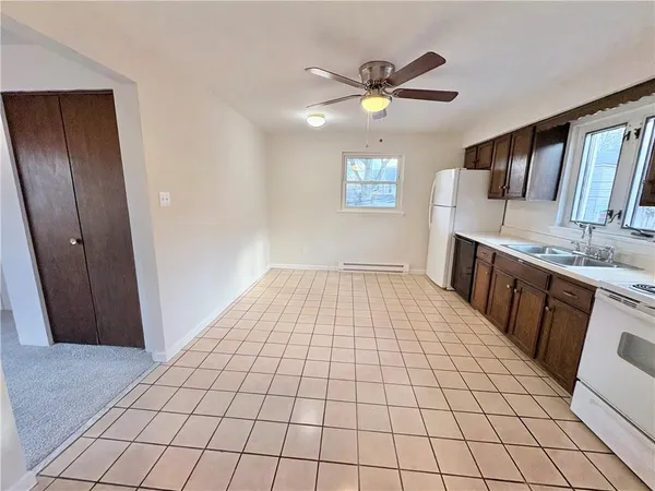 a view of a kitchen from the hallway