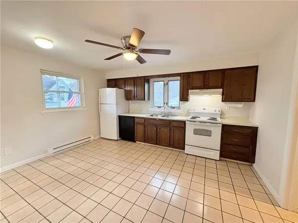 a kitchen with stainless steel appliances a sink and cabinets