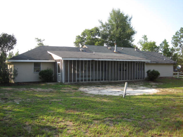 1256 Hamlin Road Lizella, GA 31052 - Photo 2 of 15 a backyard of a house