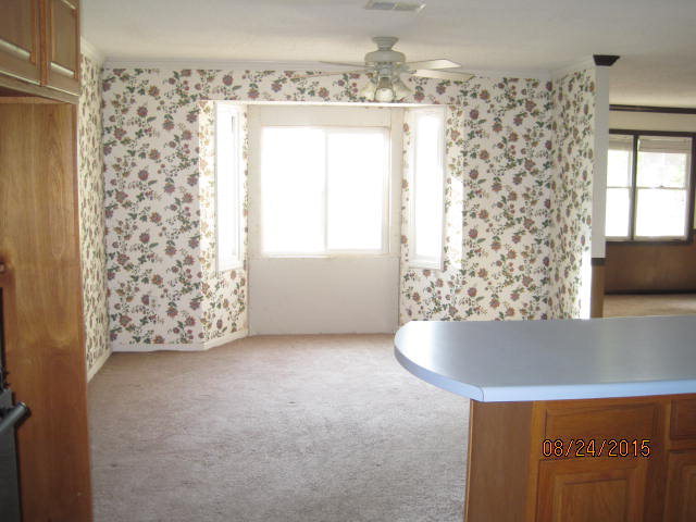 1256 Hamlin Road Lizella, GA 31052 - Photo 6 of 15 a view of wooden floor and chandelier in a room