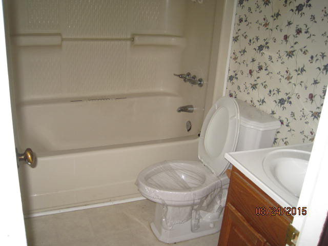 1256 Hamlin Road Lizella, GA 31052 - Photo 10 of 15 a bathroom with a sink toilet and shower