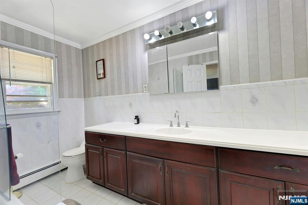 20 Blue Hill Road Norwood, NJ 07648 - Photo 23 of 49 a bathroom with a double vanity sink mirror and