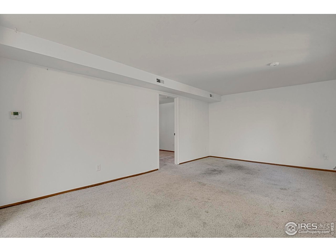 8050 Niwot Road, Unit 1 Niwot, CO 80503 - Photo 8 of 26 Actual Living room area (Seller is amenable to discuss flooring replacement)
